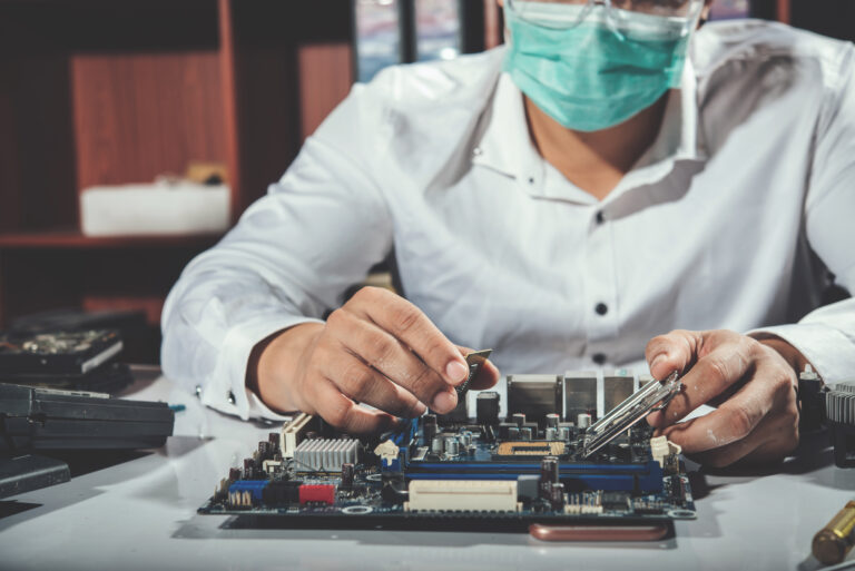 The technician repairing the computer,computer hardware, repairing, upgrade and technology